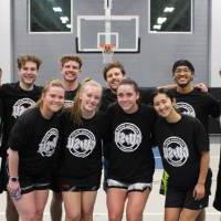 Students wearing championship shirts from a coed basketball tournament